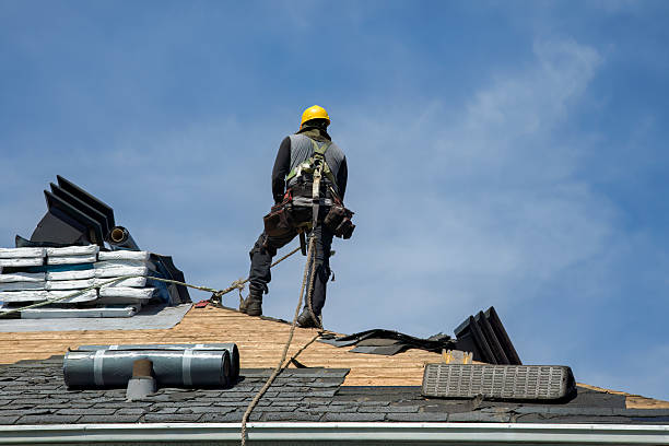 Professional Roofing technician working in Archie, MO